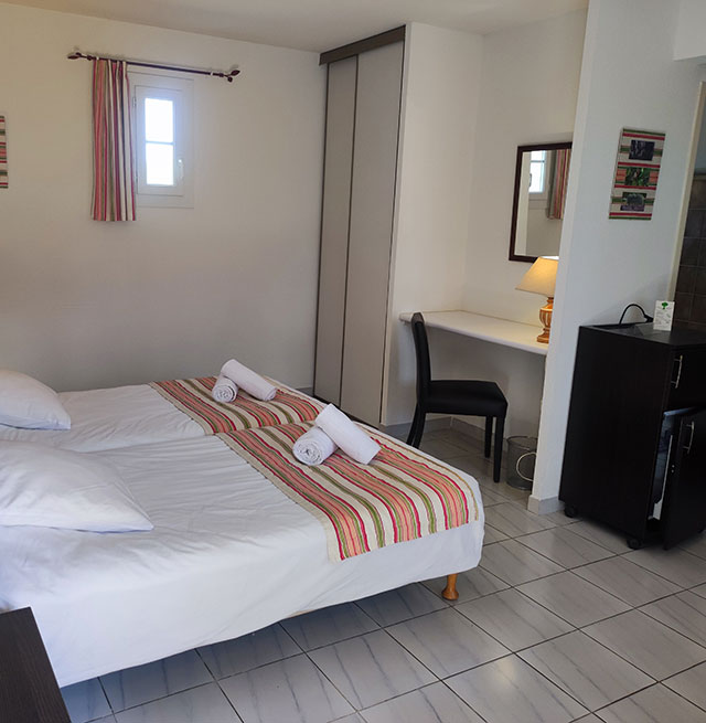 Room with two beds in the suite at the Relais du Val d'Orbieu, charming hotel in the Aude region